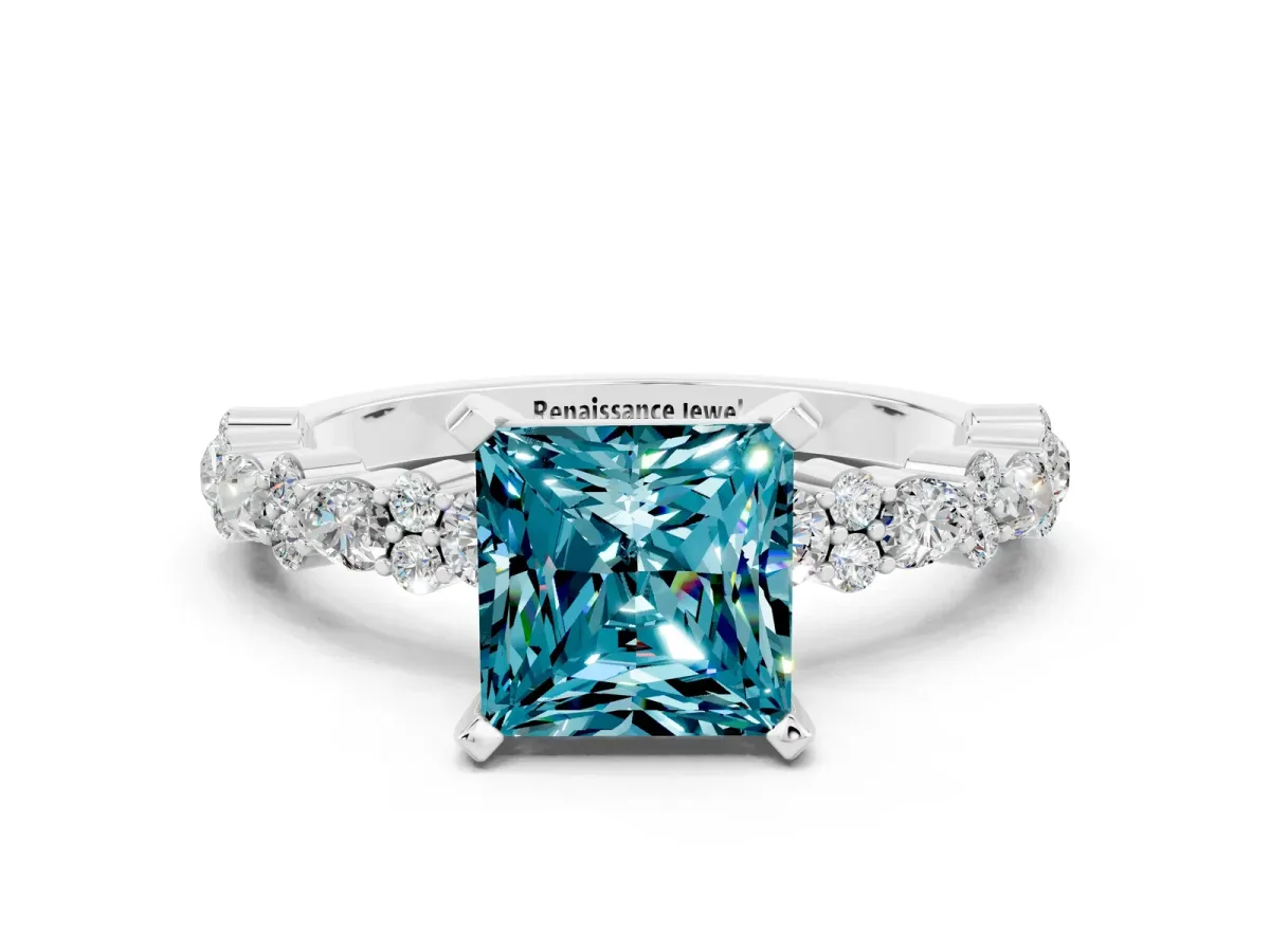 Princess Cut Blue Topaz Side Stone Solitaire Ring with Round and Four-Prong Setting Platinum