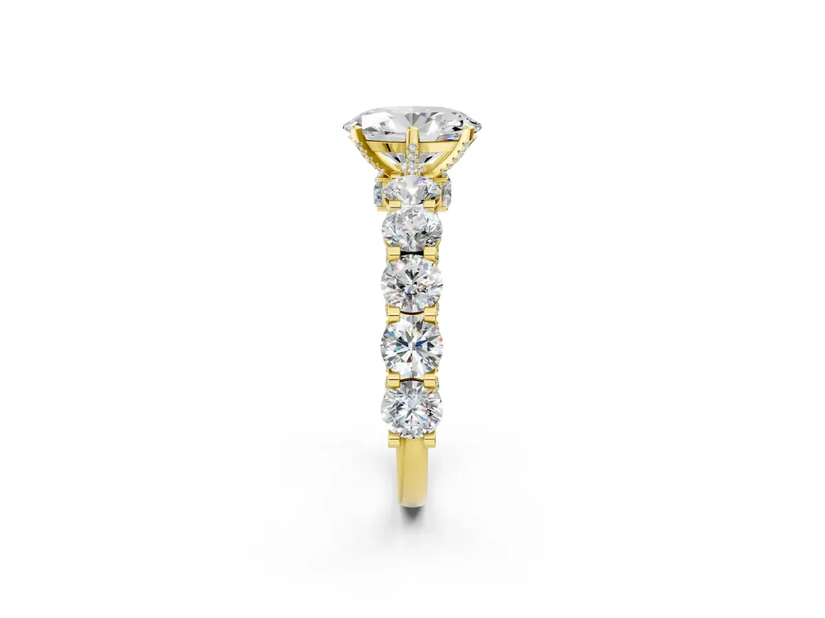 Oval Cut Diamond Side Stone Engagement Ring with Four-Prong Setting Yellow gold