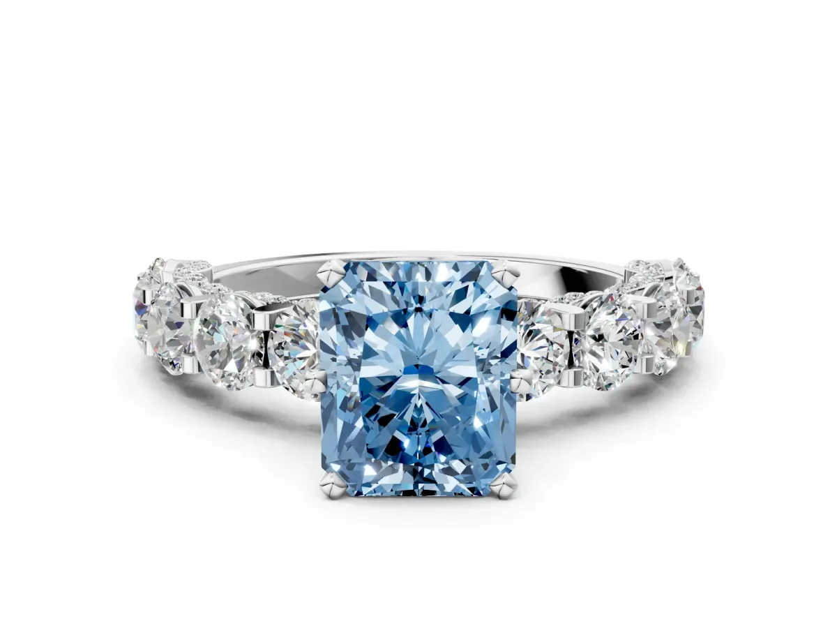 Fancy Blue Radiant Cut Diamond Side Stone Engagement Ring with Four-Prong Setting Platinum