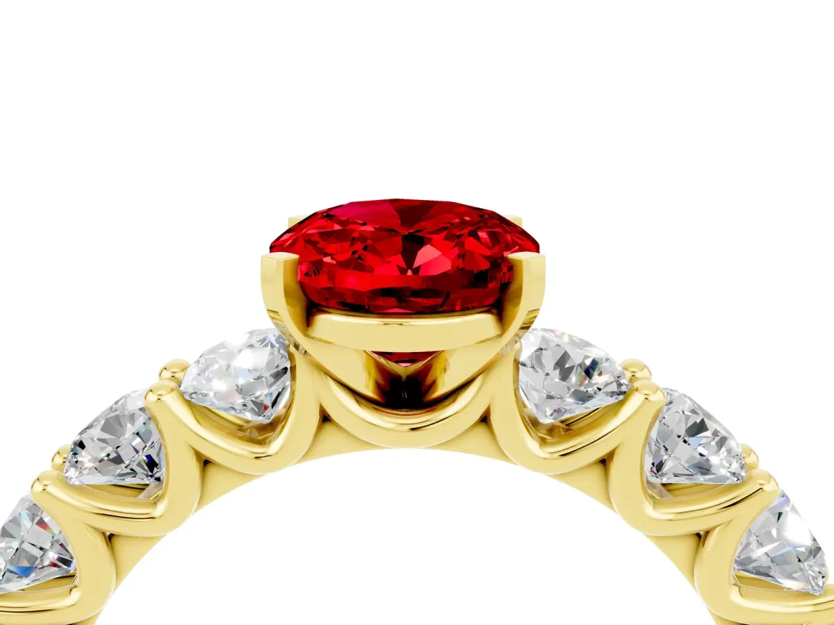 Oval Cut Ruby Prong Setting with Side Stones on a Pave Band Yellow gold