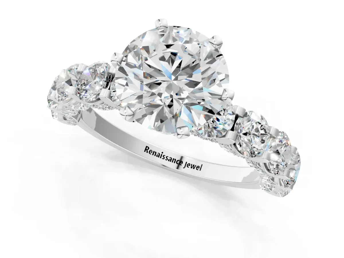 Round Cut Diamond Side Stone Engagement Ring with Four-Prong Setting White gold