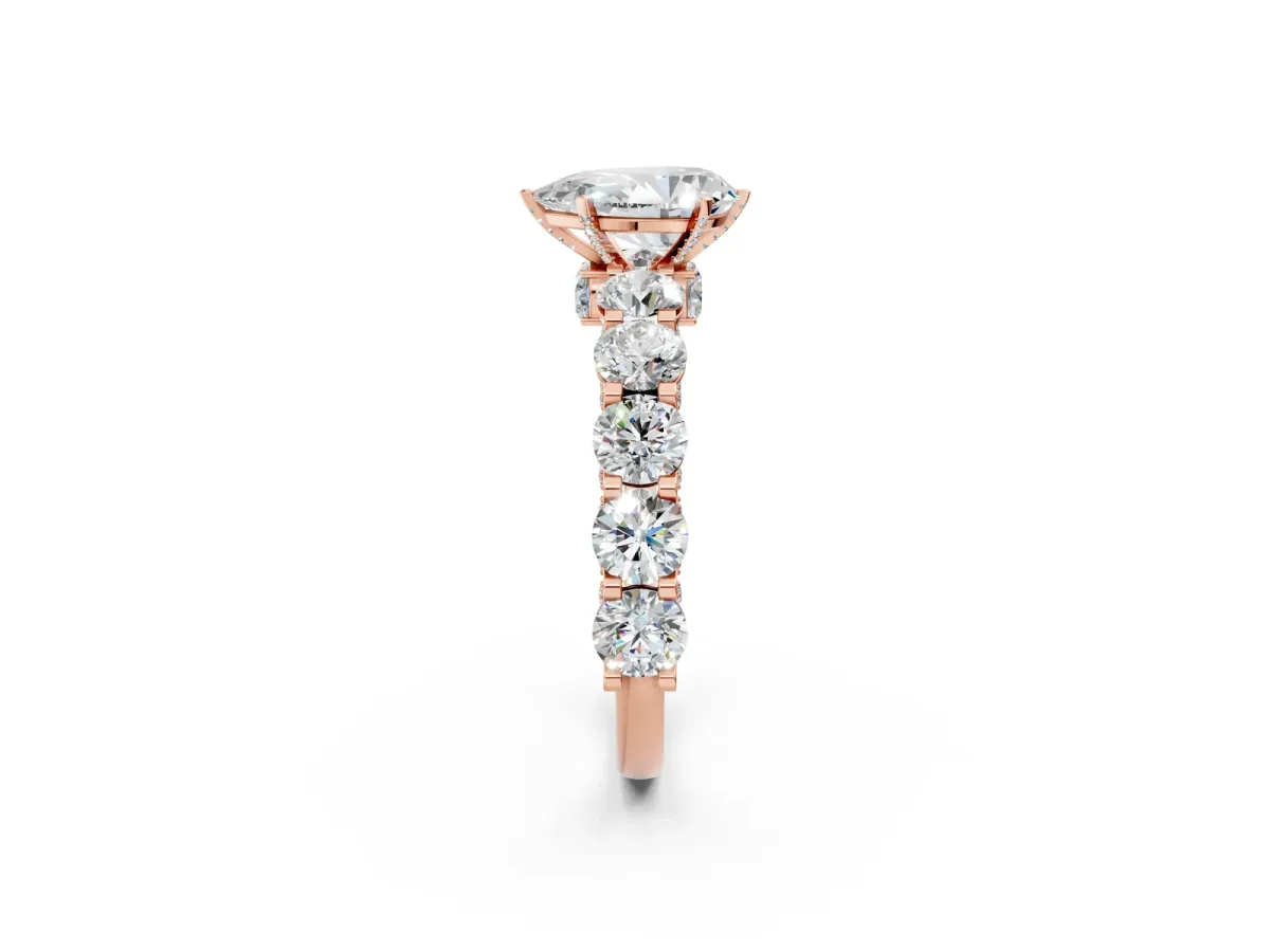 Pear Cut Diamond Side Stone Engagement Ring with Four-Prong Setting Rose gold