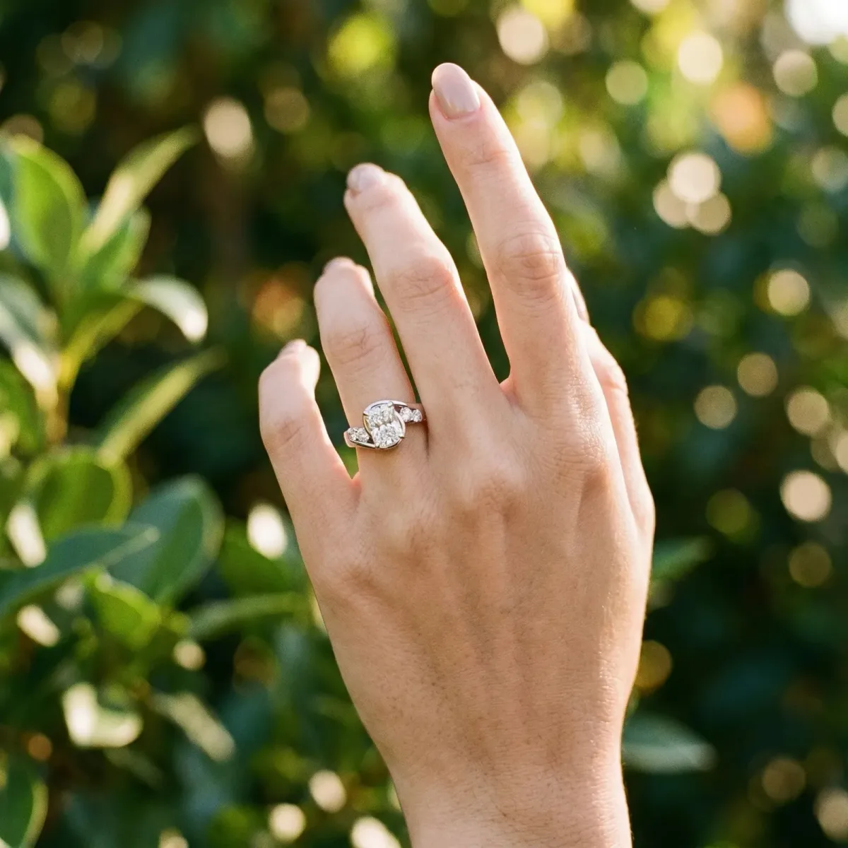 Bezel Set Radiant Cut Diamond Bypass Ring with Round Accents Platinum