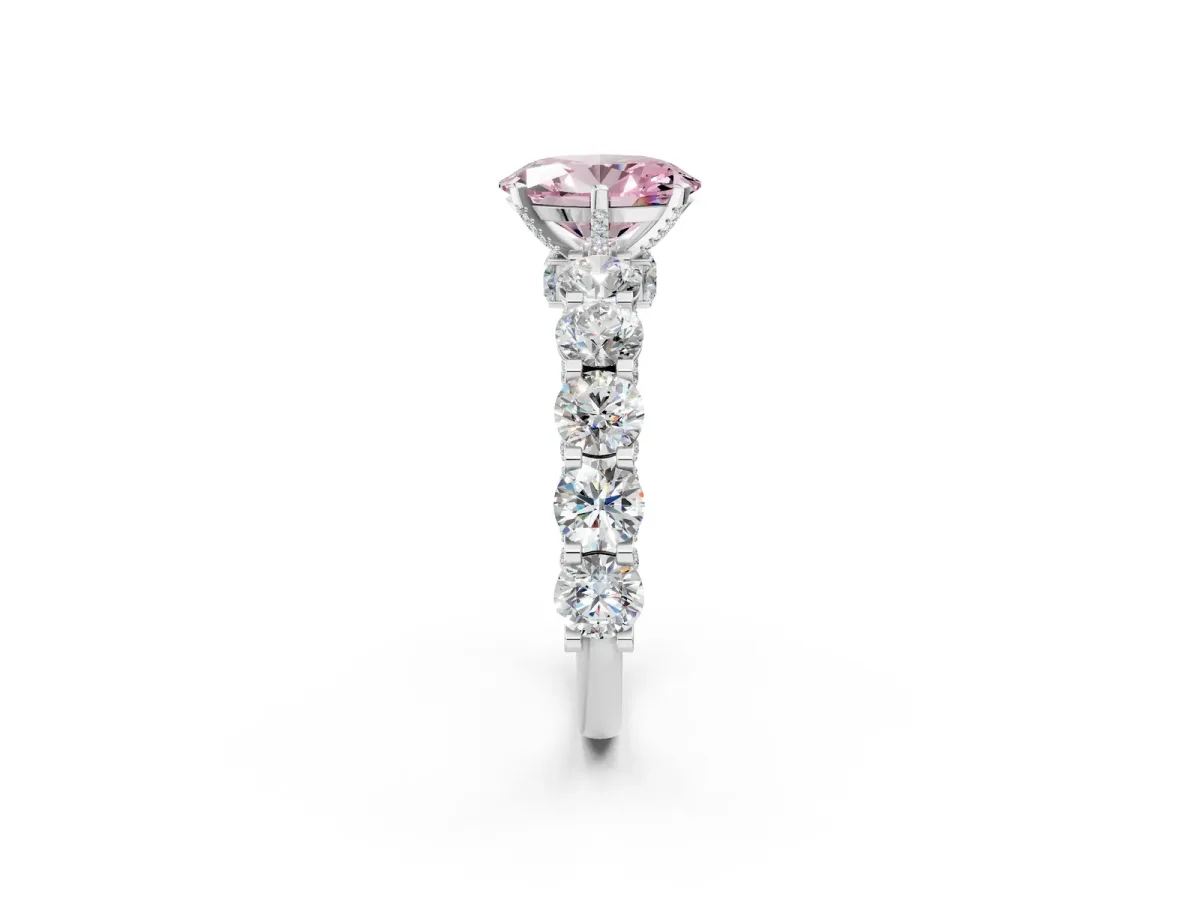Fancy Pink Oval Cut Diamond Side Stone Engagement Ring with Four-Prong Setting Platinum