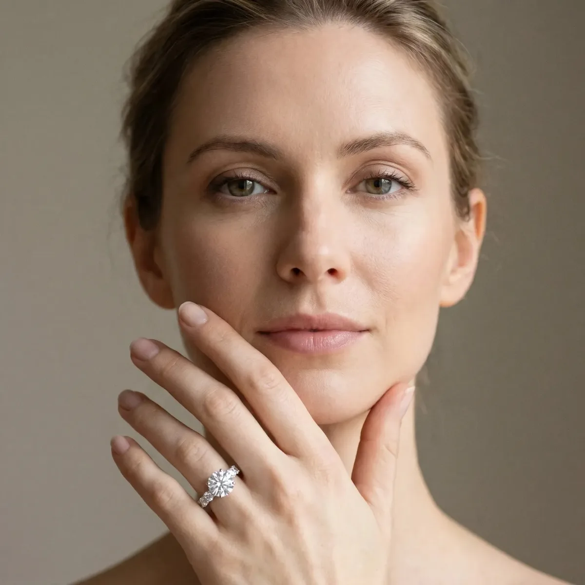 Round Cut Diamond Side Stone Engagement Ring with Four-Prong Setting White gold