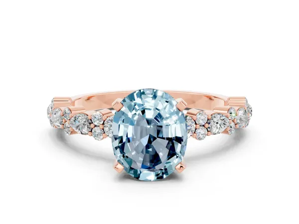 Oval Cut Aquamarine Side Stone Solitaire Ring with Round and Four-Prong Setting Rose gold