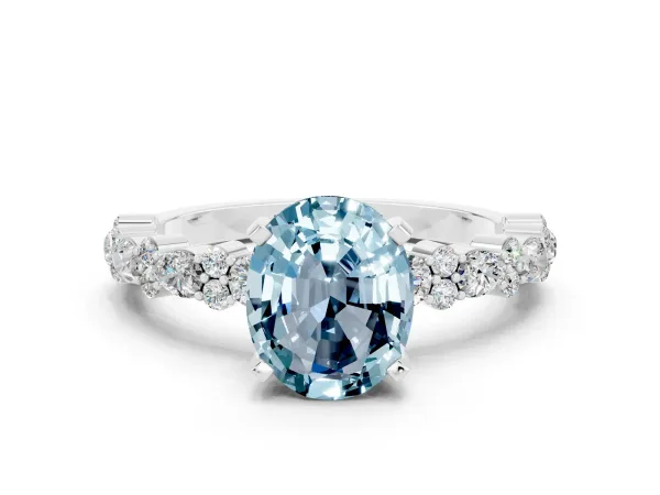 Oval Cut Aquamarine Side Stone Solitaire Ring with Round and Four-Prong Setting White gold