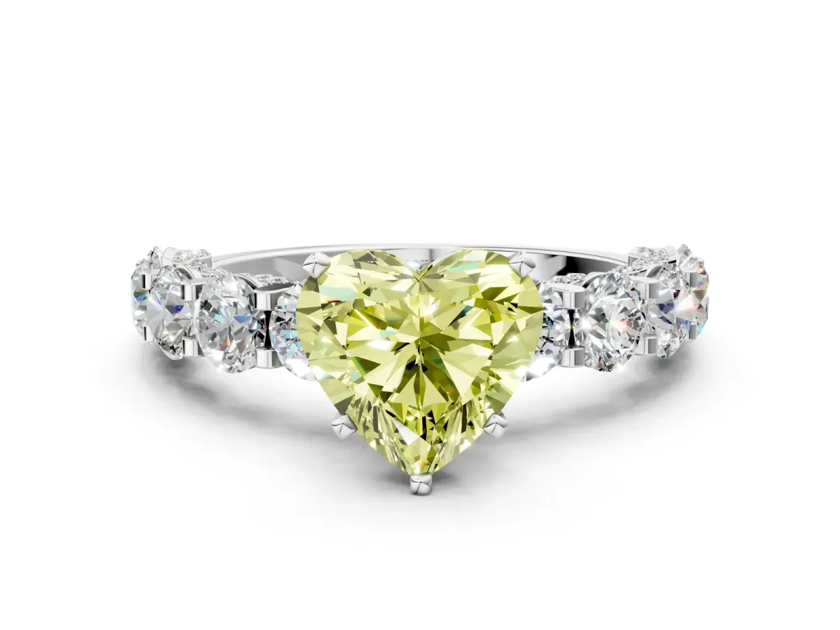 Fancy Yellow Heart Cut Diamond Side Stone Engagement Ring with Four-Prong Setting Silver