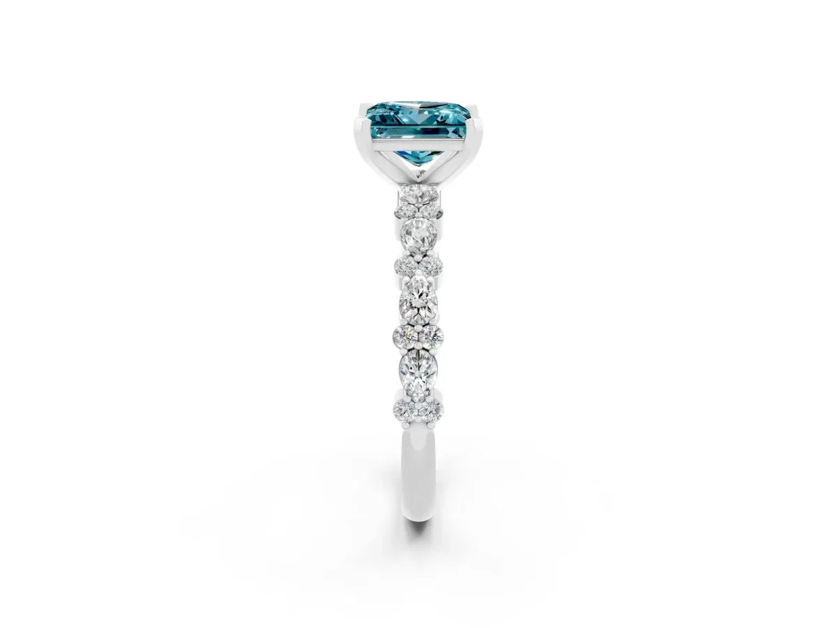 Princess Cut Blue Topaz Side Stone Solitaire Ring with Round and Four-Prong Setting Platinum