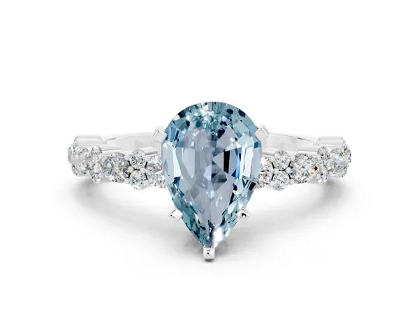 Pear Cut Aquamarine Side Stone Solitaire Ring with Round and Four-Prong Setting White gold