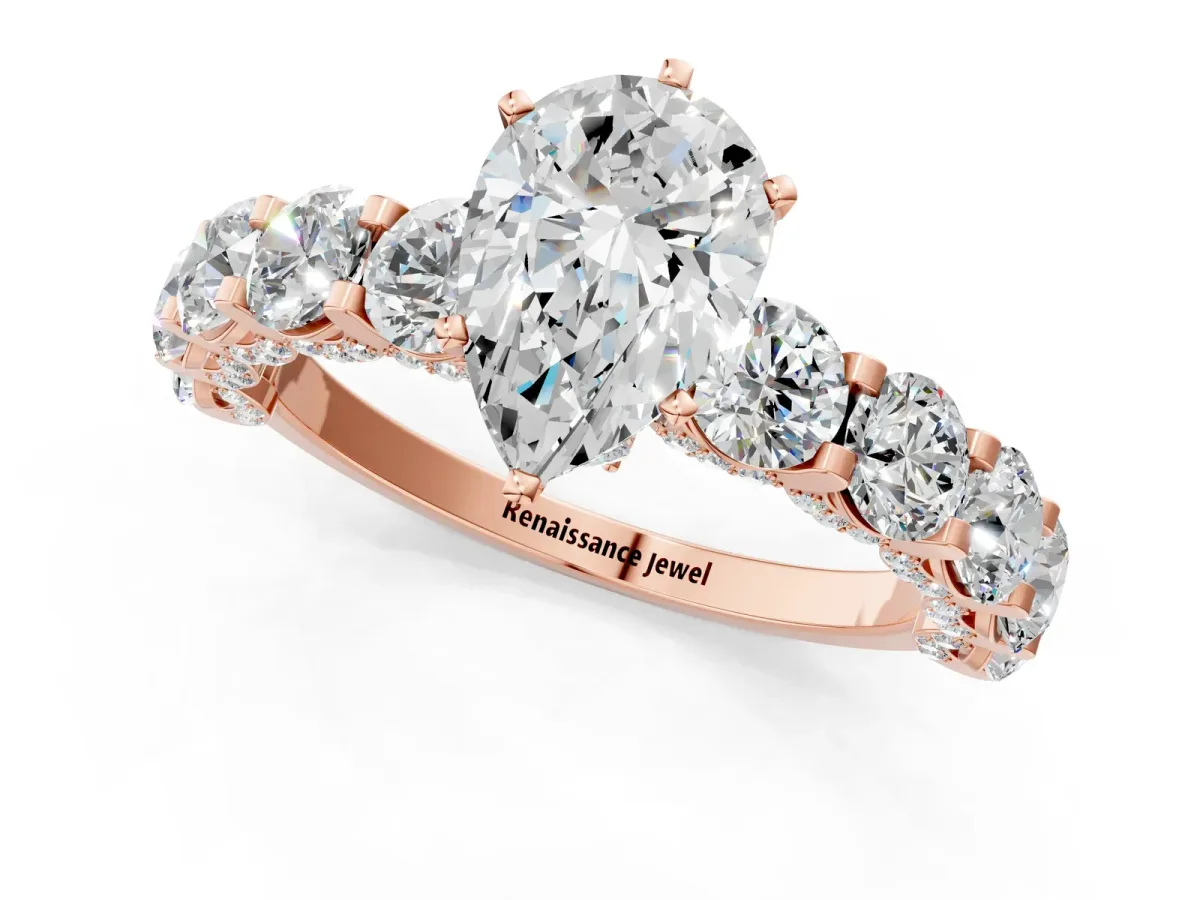 Pear Cut Diamond Side Stone Engagement Ring with Four-Prong Setting Rose gold