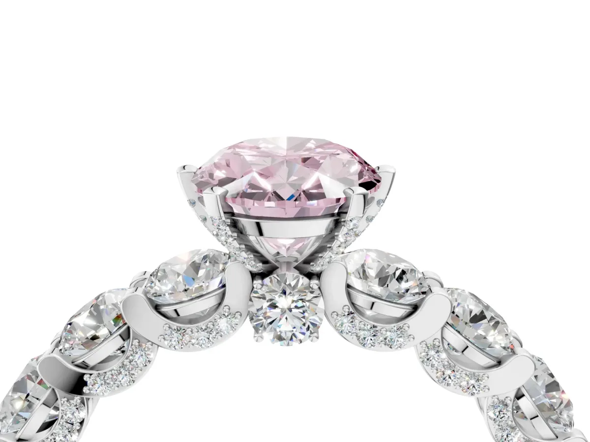 Fancy Pink Oval Cut Diamond Side Stone Engagement Ring with Four-Prong Setting Platinum