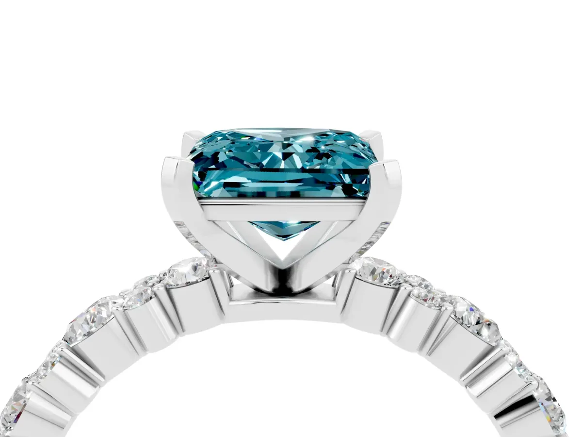 Princess Cut Blue Topaz Side Stone Solitaire Ring with Round and Four-Prong Setting Platinum