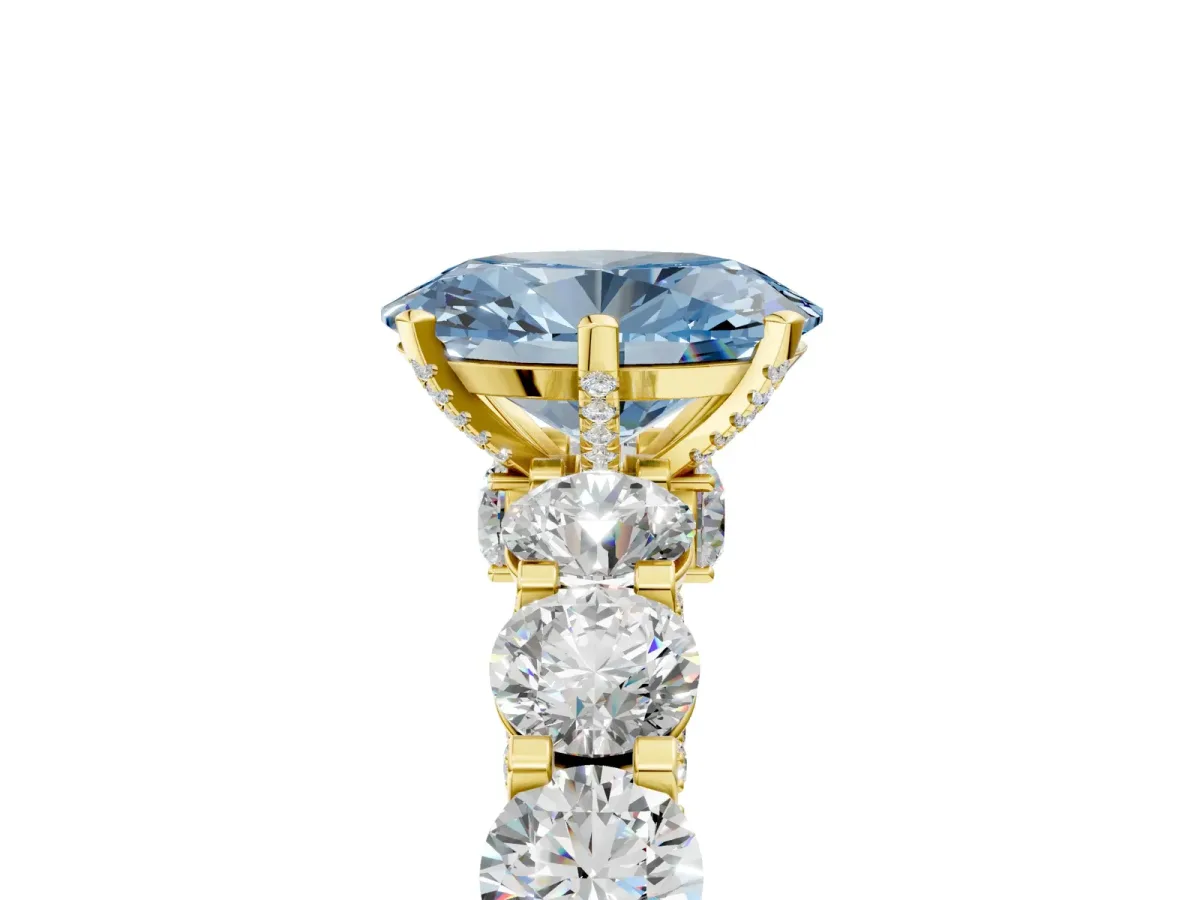 Fancy Blue Oval Cut Diamond Side Stone Engagement Ring with Four-Prong Setting Yellow gold