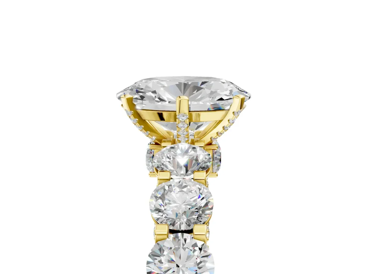 Oval Cut Diamond Side Stone Engagement Ring with Four-Prong Setting Yellow gold
