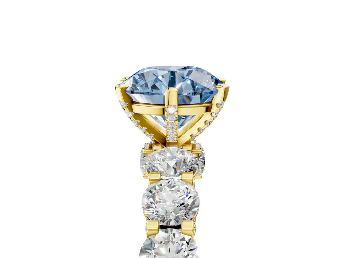 Fancy Blue Round Cut Diamond Side Stone Engagement Ring with Four-Prong Setting Yellow gold