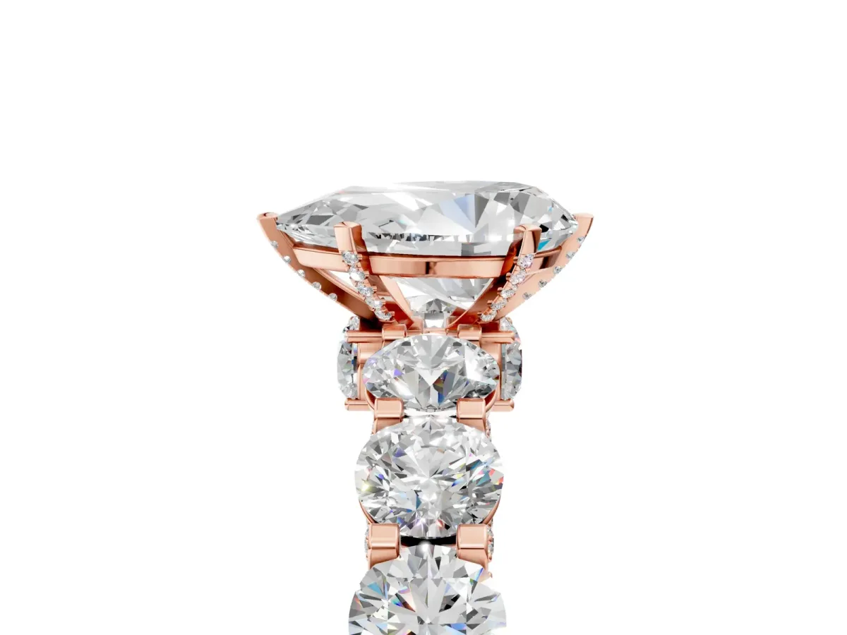 Pear Cut Diamond Side Stone Engagement Ring with Four-Prong Setting Rose gold