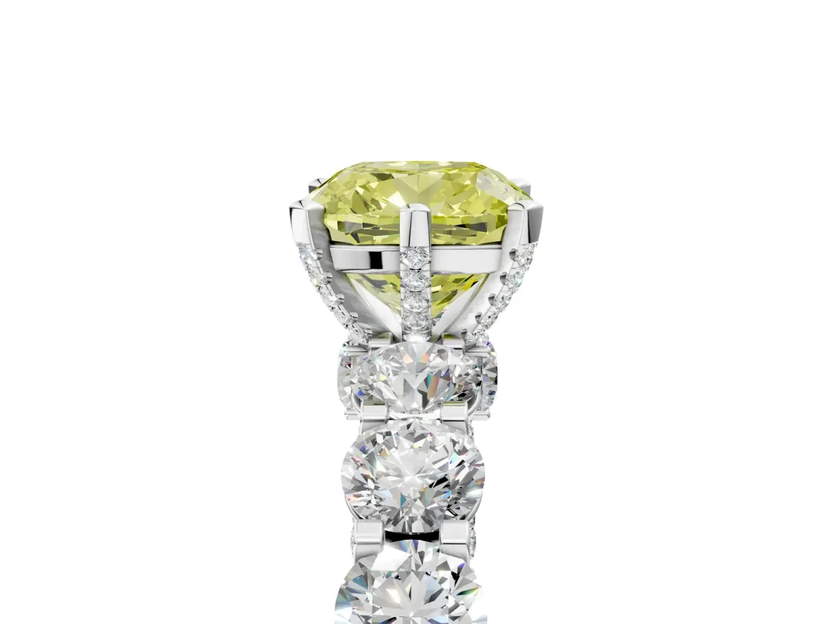 Fancy Yellow Cushion Cut Diamond Side Stone Engagement Ring with Four-Prong Setting Platinum