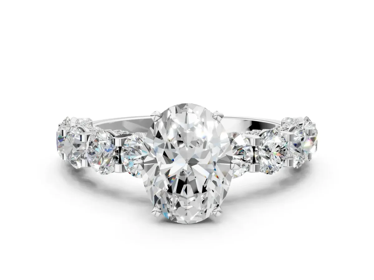 Oval Cut Diamond Side Stone Engagement Ring with Four-Prong Setting White gold