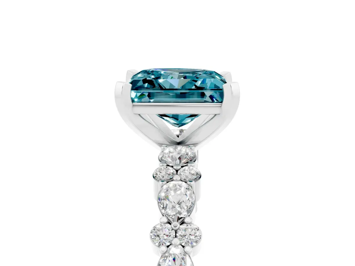 Princess Cut Blue Topaz Side Stone Solitaire Ring with Round and Four-Prong Setting Platinum
