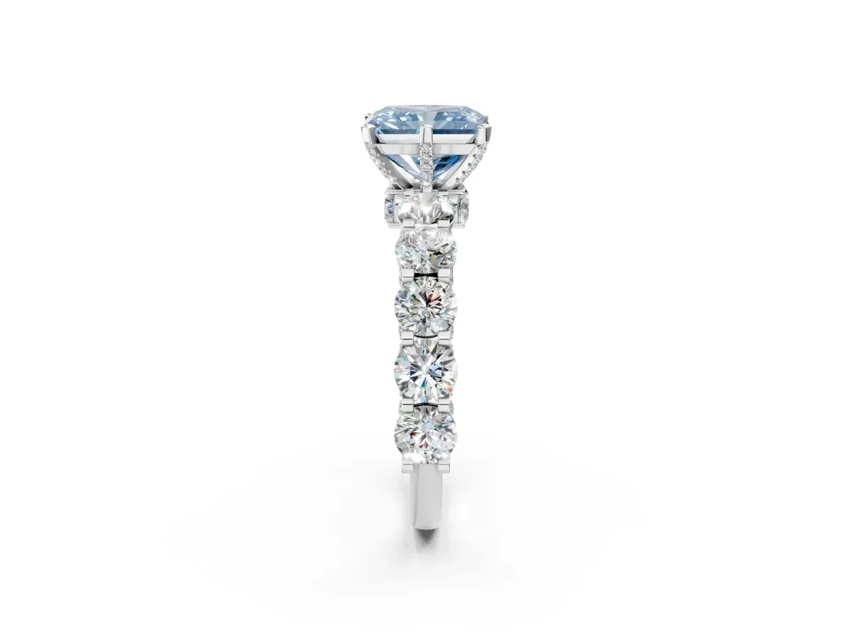 Fancy Blue Radiant Cut Diamond Side Stone Engagement Ring with Four-Prong Setting Platinum