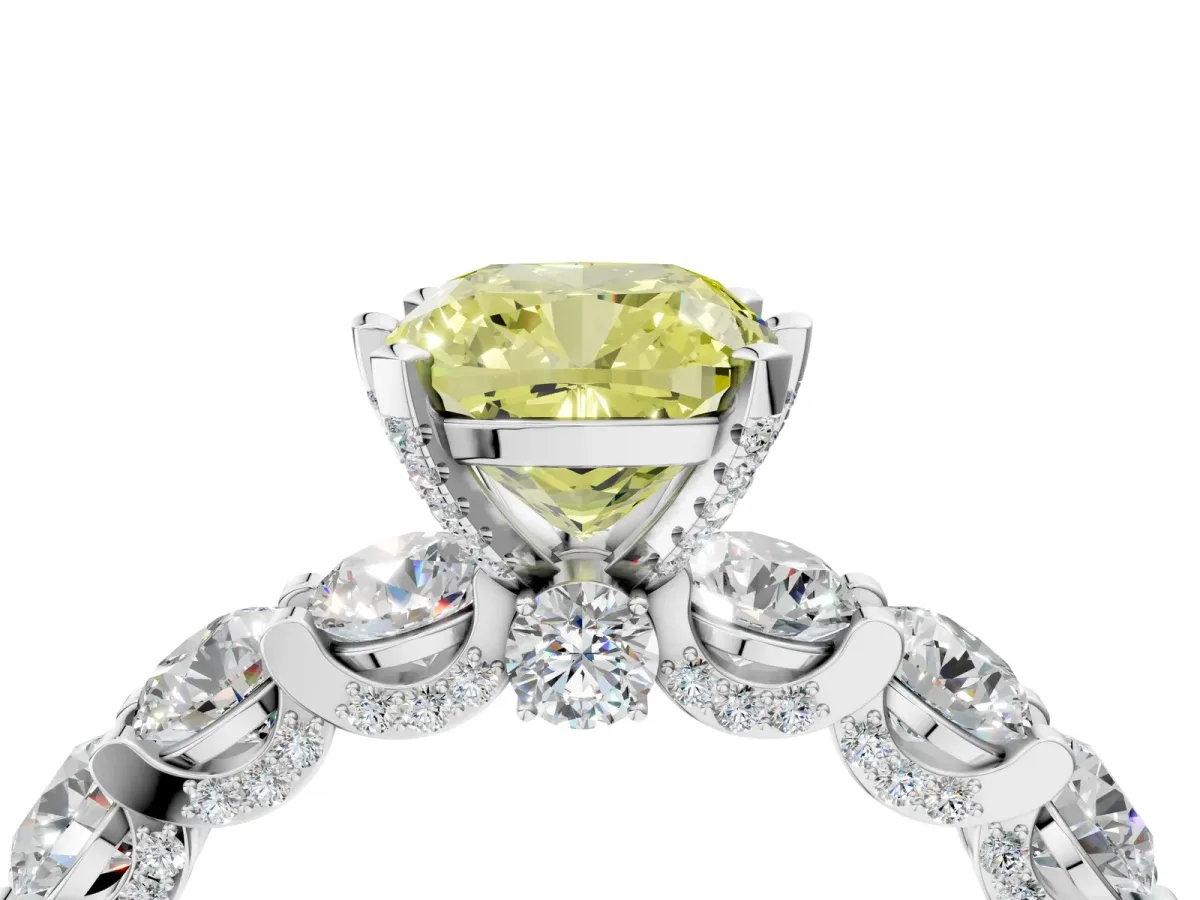 Fancy Yellow Cushion Cut Diamond Side Stone Engagement Ring with Four-Prong Setting Platinum